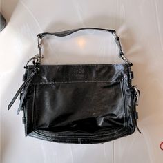 Coach Black Patent Leather Shoulder Bag. In Excellent But Used Condition, Like Brand New. Black Satchel With Palladium Hardware, Black Shoulder Bag With Palladium Hardware For Travel, Formal Black Shoulder Bag With Gunmetal Hardware, Black Crossbody Shoulder Bag With Palladium Hardware, Designer Black Shoulder Bag With Silver-tone Hardware, Black Hobo Bag With Silver-tone Hardware For Evening, Office Bags With Black Palladium Hardware, Black Office Bags With Palladium Hardware, Designer Black Hobo Bag For The Office