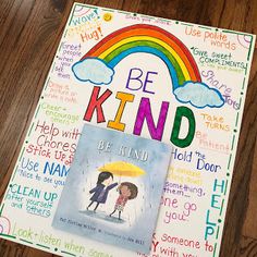 a children's book with the words be kind written on it and an umbrella