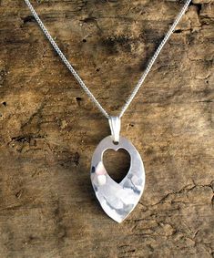 "This pendant is handmade in solid Sterling Silver by Philip Tulley and features a hammered (planished) finish which reflects the light in an interesting way. It measures approx. 12mm.(0.5\") wide and 25mm. (1.0\") long including the silver bail and is supplied with 16\" (40cm.) or 18\" (45cm) fine curb silver chain. Matching earrings are available: https://etsy.me/2D5j9Kv Please note, as all my jewellery is hand made it may differ slightly from the picture. All my jewellery is supplied in a gif Handmade Heart Pendant Necklace For Anniversary, Unique Silver Heart Necklace For Gift, Handmade Open Heart Necklace For Anniversary Gift, Handmade Sterling Silver Heart Necklace, Handmade Silver Double Heart Necklace, Hammered Silver Heart Jewelry, Handmade Silver Heart Necklace For Mom, Heart-shaped Hammered Sterling Silver Jewelry, Handmade Heart Necklace For Anniversary