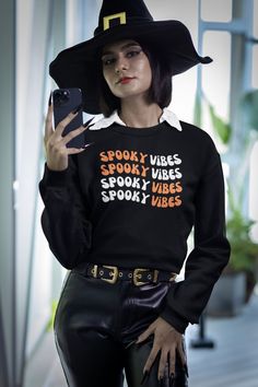 Sweatshirt, spooky season, holiday, retro, vintage, crewneck, women, oversize, spooky vibes, spooky, hallowen sweatshirt, hallowen, witchy. *Description: -Discover our Unisex Medium-Heavy Fabric Blend Sweatshirt, crafted with a balanced 50% cotton and 50% polyester, weighing 8.0 oz/yd² (271.25 g/m²). This garment is synonymous with absolute comfort. -Featuring a classic fit and a round neckline for a clean and comfortable wearing experience, this sweatshirt is perfect for all occasions. Addition Trendy Black Halloween Sweatshirt, Vintage Halloween Long Sleeve Sweatshirt, Vintage Long Sleeve Halloween Sweatshirt, Spooky Fall Sweatshirt For Streetwear, Spooky Style Fall Sweatshirt For Streetwear, Spooky Oversized Halloween Sweatshirt, Oversized Spooky Halloween Sweatshirt, Black Horror-themed Sweatshirt For Fall, Black Horror Sweatshirt For Fall