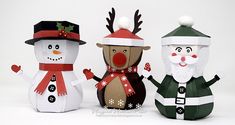 three paper snowmen are standing next to each other