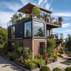 a house made out of shipping containers with plants growing on the roof and balconies