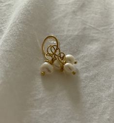 Creole named "Thuesday" - Ear studs  diameter 12mm  brass material  galvanization gilded with fine gold  nickel free, lead free, cadmium free - Rod gilded with fine gold x4 - Freshwater pearl 7-8mm x4 🛠 Handmade All jewelry is made by hand in my workshop in Paris. For this reason, each piece is unique and may differ from the photo, that's also the beauty of handmade! 🧡 Maintenance - For stainless steel and gold-plated jewelry, you can wash them with soap and water or with lemon and white vineg Gold Hypoallergenic Pearl Earrings For Gifts, Classic Adjustable Gold Pearl Earrings, Adjustable Gold Pearl Earrings With Ear Wire, Dainty Handmade Gold Pearl Earrings, Minimalist Gold Pearl Earrings Nickel-free, Minimalist Gold Nickel-free Pearl Earrings, Minimalist Gold Pearl Earrings Nickel Free, Everyday Gold Pearl Hypoallergenic Earrings, Everyday Gold Hypoallergenic Pearl Earrings