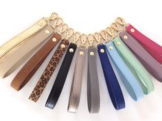 a bunch of different colored leather key chains