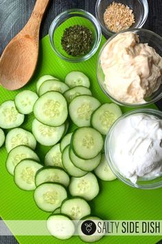 cucumbers and other ingredients are arranged on a cutting board