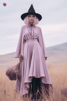 a woman with pink hair wearing a purple dress and black hat standing in tall grass