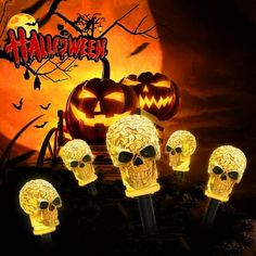 halloween skull head light up candles with pumpkins in the background