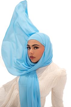 Discover the ultimate in luxury and coverage with our exclusive matching hijab and undercap set. Crafted from luxurious, soft, buttery and opaque chiffon, the elegantly tailored hijabs feature a breathable and tieback bamboo jersey undercap to keep your hair hydrated all day. These hijabs provide the ultimate coverage with approximately 80% opacity. Whether you're looking for a casual or dressy look, this timeless hijab and undercap set is sure to complete your sophisticated ensemble. Elegant Blue Hijab For Eid, Head Covering, Blue Sky, Chiffon, Hair