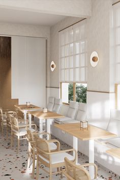 an empty restaurant with wooden tables and white chairs on the floor, in front of large windows