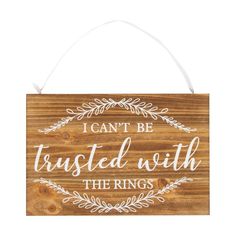 a wooden sign with the words i can't be trusted with the rings