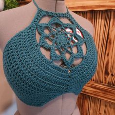 a crocheted halter top on a mannequin