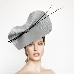 Elegant silver and black Kentucky derby hat for woman. This grey fascinate hat is embellished with two quills and a beautiful beaded aplique. It is a perfect hat for weddings, Royal Ascot horse races, cocktails, derby... It is mounted on a headband. If you want, you can choose the side of the head were you like to wear the fascinator, just convo me. Any color of the fascinator can be changed to order. ** PROCESSING TIME: 5 -7 business days. ** DELIVERY TIME (DHL EXPRESS WITH TRACKING NUMBER): 2- Grey Fascinator, Ascot Horse Racing, Hat Feathers, Race Day Hats, Hat For Woman, Ivory Fascinator, White Fascinator, Ascot Races, Kentucky Derby Fascinator