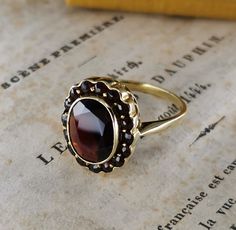 Beautiful rare antique German ring, 14k gold garnet ring, the ring face measures 13x 17 mm, US Size 8 1/2, the ring is in good condition.  Material: 14k gold, garnet Total weight: approx. 4.8 g US Size: approx. 8 1/2 (EU size 58) Box on the photos not included! PLEASE LOOK AT THE PICTURES, THEY ARE PART OF THE DESCRIPTION AND ARE THE ACTUAL ITEM YOU WILL RECEIVE. Victorian Wedding Signet Ring With Gemstone, Antique Gemstone Signet Ring For Wedding, Victorian Gemstone Signet Ring For Formal Occasions, Victorian Gemstone Signet Ring For Formal Events, Antique Gemstone Cluster Ring For Formal Occasions, Antique Formal Cluster Ring With Gemstone, Antique Gold Cluster Ring, Heirloom Oval Garnet Cluster Ring, Formal Yellow Gold Garnet Cluster Ring