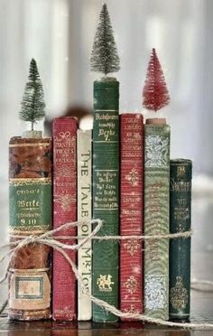 a stack of books with christmas trees on top