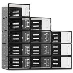 several black and white boxes stacked on top of each other in front of a white background