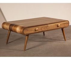 a wooden coffee table with two drawers on one side and an open drawer on the other