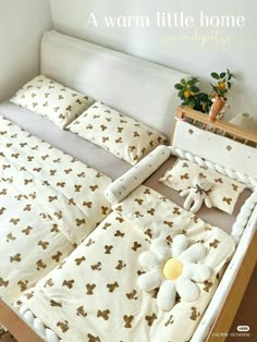 a bed with white sheets and brown bows on it