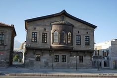 an old building with many windows on the front