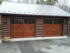 a garage with two wooden doors and a metal roof