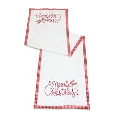 two red and white kitchen towels with merry lettering