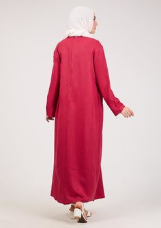 This Slip Dress boasts a loose, A-shape cut for a comfortable and flattering fit. Its long maxi sleeves add a touch of elegance, while the lightweight fabric allows for easy movement. Perfect for any throw over abaya or as a slip dress under sheer garments or as a basic dress on its own, this dress is a must-have addition to your wardrobe. Expertly designed for versatility and comfort, the Dark Pink Kira loose slip dress is a staple for any modest fashion store. With its A-shape cut, it offers a Spring Long Sleeve Maxi Dress With Side Slits, Spring Maxi Length Abaya, Oversized Long Sleeve Maxi Dress For Fall, Spring Long Maxi Dress With Pockets, Casual Long Sleeve Abaya With Modesty Panel, Casual Long Sleeve Dresses With Side Slits, Modest Maxi Length Abaya For Fall, Fall Modest Maxi Length Abaya, Fall Season Modest Maxi Length Abaya