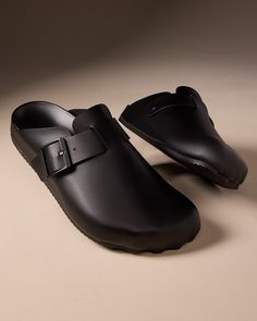 Balenciaga "Sunday" calfskin leather mules with logo-engraved buckle strap accent Flat heel Round toe Notched vamp Slide style Molded comfort footbed Rubber outsole Wipe clean Made in Italy Slip-on Mules With Buckle Closure And Round Toe, Designer Black Mules With Buckle Closure, Luxury Slip-on Monk Strap Shoes With Buckle, Luxury Buckle Closure Slip-on Mules, Brown Slip-on Mules With Buckle Closure, Cristóbal Balenciaga, First Perfume, Leather Mules, Calf Skin