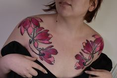 a woman with flowers painted on her chest