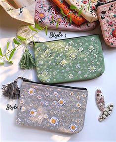 four different types of purses with flowers on them