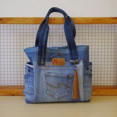 Everyday Distressed Denim Bag, Denim Distressed Shoulder Bag For Daily Use, Daily Use Distressed Denim Shoulder Bag, Distressed Denim Shoulder Bag For Daily Use, Daily Use Upcycled Denim Shoulder Bag, Upcycled Medium Wash Recycled Denim Shoulder Bag, Vintage Denim Shoulder Bag, Everyday Distressed Denim Blue Bag, Upcycled Recycled Denim Tote Shoulder Bag