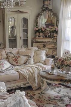 a living room filled with furniture and a chandelier