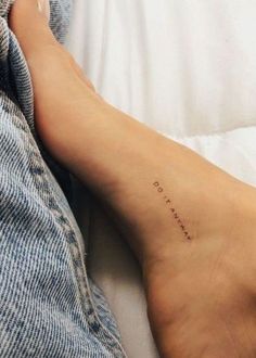 a person with a small tattoo on their foot that says, i love you so much