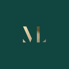 the letter l is made up of gold foil on a dark green background with white lines