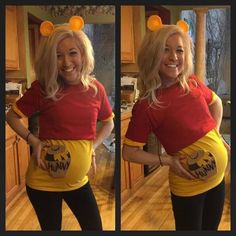 a woman in a winnie the pooh costume is smiling and holding her belly up