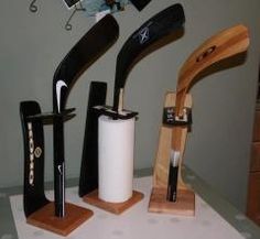 three different types of knives on display in a room with white polka dot tablecloth