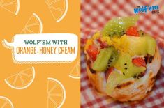 an orange honey cream filled pastry on a checkered table cloth with the words wolffem with orange - honey cream