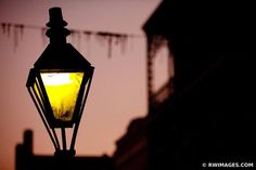 a street light is lit up in the dark