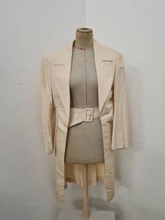 Comme des Garçons evening coat in perfect vintage condition  Trench coat in cream coloured silk From the 80's  Padded shoulders. Very unique exclusive piece  Size M Summer Silk Formal Outerwear, Beige Fitted Long Outerwear, Fitted Long Beige Outerwear, Beige Long Formal Outerwear, Formal Long Beige Outerwear, Chic Beige Wedding Blazer, Chic Beige Blazer For Weddings, Fitted Cream Outerwear For Evening, Cream Fitted Evening Outerwear