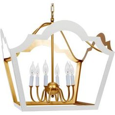 a white and gold chandelier with five candles hanging from the front, on an isolated white background