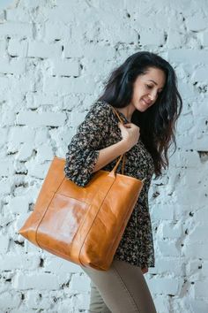 Wonderful tote bag of vintage leather quality , it will be perfect as your essential bag for everyday wear,  for students,for work or shopping.This brown shoulder bag has linen of beige color (one of the photos clearly shows it), it also helps to preserve shape of the bag. While making this bag we used the most high quality leather - top grain leather, vegetable tanned leather. Basic bag includes:- one inside pocket and one sliding outside pocket-zipper closure-handles -50 cm- shoulder strap (yo Trendy Leather Laptop Bag For Daily Use, Casual Rectangular Shoulder Bag With Leather Lining, Trendy Leather Laptop Bag With Large Capacity, Trendy Leather Shoulder Bag With Interior Card Slots, Trendy Rectangular Leather Laptop Bag, Trendy Leather Laptop Bag Rectangular, Trendy Leather Laptop Bag In Rectangular Shape, Trendy Rectangular Shoulder Bag With Leather Lining, Brown Shoulder Laptop Bag For Shopping