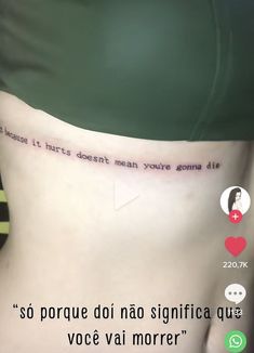 the back of a woman's stomach with words written on it