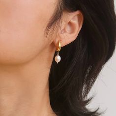 Add a touch of elegance to your everyday look with our Charlotte Freshwater Pearl Drop Earrings. These timeless beauties feature high-quality freshwater pearls hanging from 18K plated gold stud, perfect for any occasion. Elevate your style and feel confident with these simple yet classic earrings. To keep your jewellery in the best condition, we recommend giving it a good care over time. By using a soft, lint-free jewellery cloth, you can remove blemishes that result from body oils, perfumes and lotions. Also remember try not to expose your jewellery in the open air. Our branded dusty bag or your jewellery box will keep them last longer. If you go to gym or spa, remember to take them off, because water or sweat will also damage them. Freshwater Pearl Drop Earrings, September Birthstone Jewelry, August Birthstone Jewelry, July Birthstone Jewelry, Body Oils, Classic Earrings, Jewelry Ring Box, Pearl Jewellery Earrings, Gold Stud