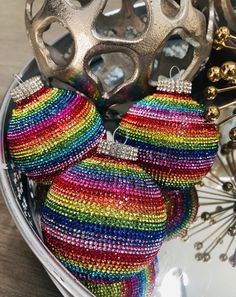 there is a pair of colorful beaded ornaments on the table