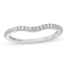 a white gold wedding band with round cut diamonds