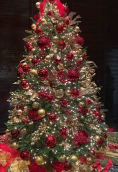 a christmas tree with red and gold ornaments