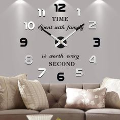 a living room wall clock with the words time spent with family is worth every second