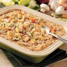 a casserole dish filled with stuffing and vegetables