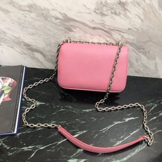 SHOP MORE LUXURY PRODUCTS HERE Description Prada Saffiano Mini-Bag Pink For Women, Women’s Bags 7.3in/19cm This Saffiano mini-bag with shoulder strap has a refined minimalist design. The accessory is decorated with the metal logo. Size: 18.5 x 12 x 4 cm /7.3 x 4.7 x 1.6 inches (Length x Width x Height) PinkSaffianoDetachable tonal metal chain shoulder strap with shoulder padFlap closureInside pocket with removable mirrorInside pocket with card slotsNylon and nappa lining Includes box, dust Louis Vuitton Shirt, Chanel Shirt, Prada Saffiano, Metal Logo, Design Minimalista, Metallic Logo, Pink Bag, Belts For Women, Metal Chain