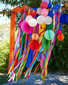 the instagram page is full of colorful paper lanterns and streamers hanging from trees