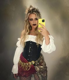 a woman in a costume taking a selfie