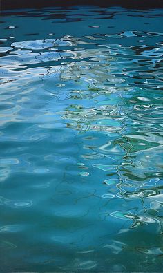 the water is blue and green with ripples on it